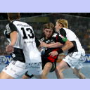 B�rge Lund stoppt Gregorz Tkaczyk.